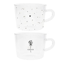 Thumbnail for Bastion Collections Teeglas-Set Daisies & tea time FOREVER 2tlg. versch. Motive Glas transparent schwarz bedruckt gedeckter Tisch