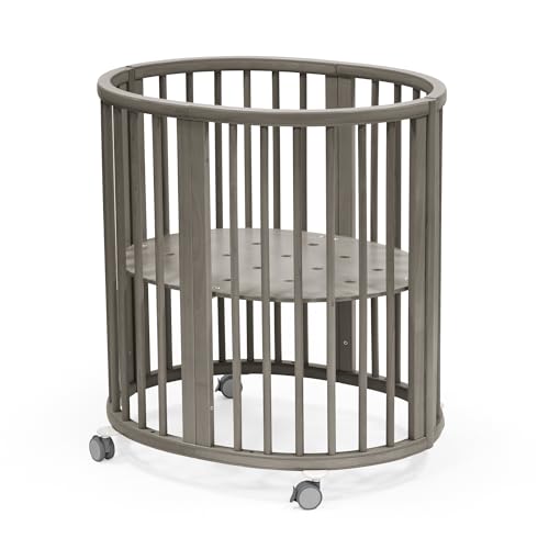 Stokke Sleepi Mini, Hazy Grey - Ovales Kinderbett für 0-6 Monate - Höhenverstellbares Gestell, feststellbare Schwenkräder, perforierte Matratzenauflage für Luftzirkulation im Sale